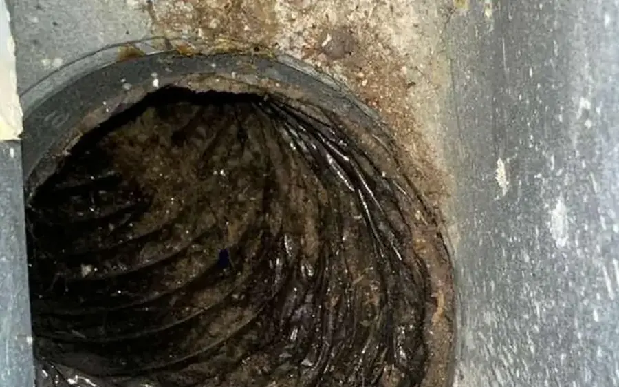 Duct connection with rust staining found during inspection