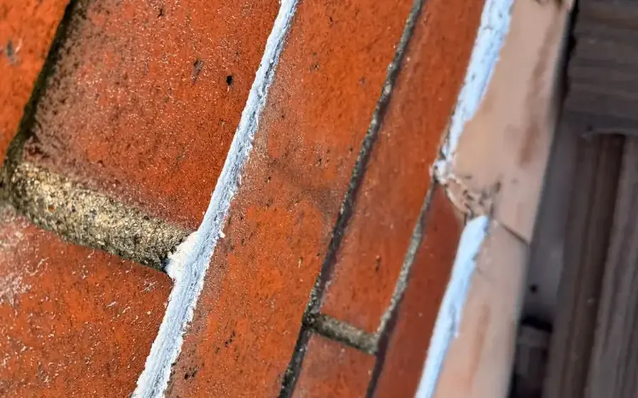 Chimney brick and mortar joints prepared for sealing